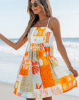 Oranje Zomerdress met Schelpenprint, Patchwork en Zwierige Striksluiting - Bella Fit™